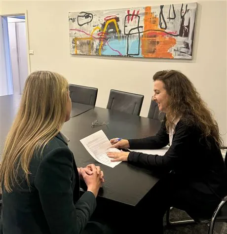 Two people in discussion across a table
